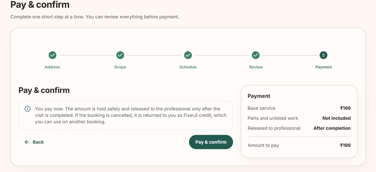 FixerJi’s payment step, saying the amount is held and released to the professional after the visit, or returned as FixerJi credit if the booking is cancelled